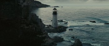 Movie still from “Shutter Island” (2010), directed by Martin Scorsese – A light house on a rock in the middle of the ocean; Extreme Wide shot, High angle
