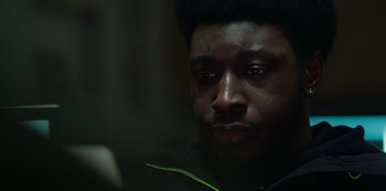 Movie still from “Top Boy” (2011), created by Ronan Bennett – A person looking at the camera; Close Up shot, Low angle