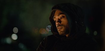 Movie still from “Top Boy” (2011), created by Ronan Bennett – A person wearing a hooded sweatshirt; Close Up shot, Low angle
