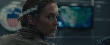 Movie still from “Sicario” (2015), directed by Denis Villeneuve – A person looking at the camera; Close Up shot, Over the shoulder angle