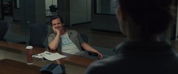 Movie still from “Sicario” (2015), directed by Denis Villeneuve – A man sitting in front of another man at a table; Medium shot, Over the shoulder angle