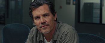 Movie still from “Sicario” (2015), directed by Denis Villeneuve – A person with a beard; Close Up shot, Over the shoulder angle