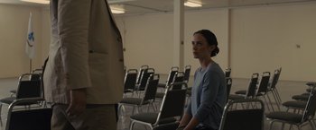 Movie still from “Sicario” (2015), directed by Denis Villeneuve – A woman sitting in front of a man in a suit; Medium shot, Over the shoulder angle