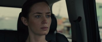 Movie still from “Sicario” (2015), directed by Denis Villeneuve – A person sitting in a car; Close Up shot, Over the shoulder angle