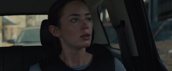 Movie still from “Sicario” (2015), directed by Denis Villeneuve – A person sitting in a car; Close Up shot, Over the shoulder angle
