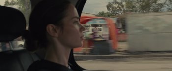 Movie still from “Sicario” (2015), directed by Denis Villeneuve – A woman looking out the window of a car; Close Up shot, Over the shoulder angle