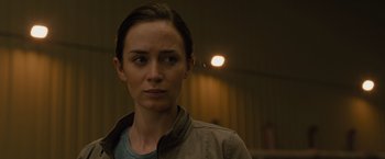 Movie still from “Sicario” (2015), directed by Denis Villeneuve – A person wearing a jacket; Close Up shot, Over the shoulder angle