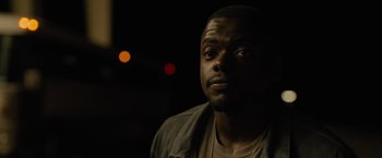 Movie still from “Sicario” (2015), directed by Denis Villeneuve – A person wearing a jacket; Close Up shot, Over the shoulder angle