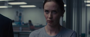 Movie still from “Sicario” (2015), directed by Denis Villeneuve – A person wearing a gray t - shirt; Close Up shot, Over the shoulder angle