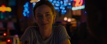Movie still from “Sicario” (2015), directed by Denis Villeneuve – A person sitting at a table; Close Up shot, Over the shoulder angle