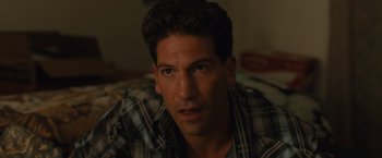 Movie still from “Sicario” (2015), directed by Denis Villeneuve – A person wearing a plaid shirt; Close Up shot, Over the shoulder angle