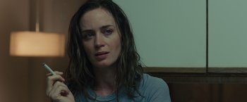 Movie still from “Sicario” (2015), directed by Denis Villeneuve – A person with long brown hair; Close Up shot, Over the shoulder angle