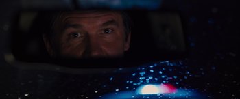 Movie still from “Sicario” (2015), directed by Denis Villeneuve – A person's face in front of a window; Close Up shot, Over the shoulder angle