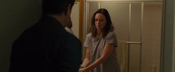 Movie still from “Sicario” (2015), directed by Denis Villeneuve – A woman standing in front of a man in a room; Medium shot, Over the shoulder angle