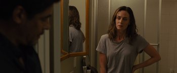 Movie still from “Sicario” (2015), directed by Denis Villeneuve – A woman standing in front of a bathroom mirror; Close Up shot, Over the shoulder angle