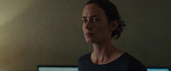 Movie still from “Sicario” (2015), directed by Denis Villeneuve – A person wearing a black shirt; Close Up shot, Low angle