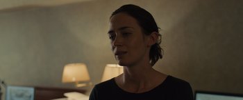 Movie still from “Sicario” (2015), directed by Denis Villeneuve – A person wearing a black shirt; Close Up shot, Over the shoulder angle