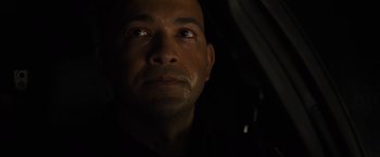 Movie still from “Sicario” (2015), directed by Denis Villeneuve – A person's face in the dark; Close Up shot, Low angle