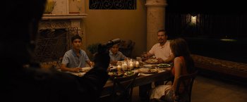 Movie still from “Sicario” (2015), directed by Denis Villeneuve – A group of people sitting at a dinner table; Medium shot, Over the shoulder angle