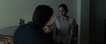 Movie still from “Sicario” (2015), directed by Denis Villeneuve – A man and a woman sitting in front of each other; Medium shot, Over the shoulder angle