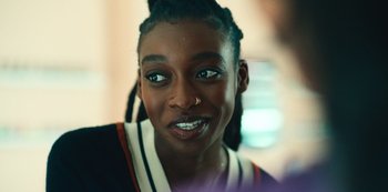 Movie still from “Top Boy” (2011), created by Ronan Bennett – A person with a nose ring; Close Up shot, Over the shoulder angle