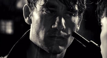 Movie still from “Sin City” (2005), directed by Frank Miller – Black and white close up of a man's face; Close Up shot, Low angle