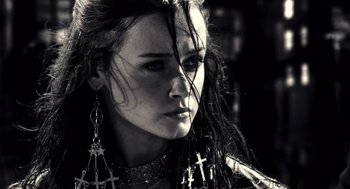 Movie still from “Sin City” (2005), directed by Frank Miller – A person with long hair; Close Up shot, Low angle