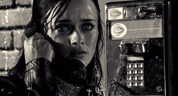 Movie still from “Sin City” (2005), directed by Frank Miller – A black and white photo of a woman talking on a phone; Close Up shot, Low angle