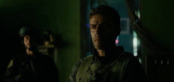 Movie still from “Triple Frontier” (2019), directed by J.C. Chandor – A person wearing a uniform; Close Up shot, Over the shoulder angle