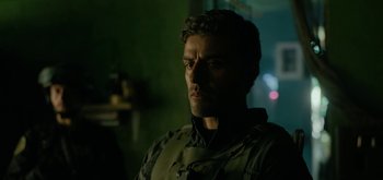 Movie still from “Triple Frontier” (2019), directed by J.C. Chandor – A person wearing a jacket; Close Up shot, Over the shoulder angle