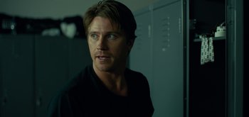 Movie still from “Triple Frontier” (2019), directed by J.C. Chandor – A person in a black shirt; Close Up shot, Over the shoulder angle