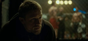 Movie still from “Triple Frontier” (2019), directed by J.C. Chandor – A person wearing a jacket; Close Up shot, Over the shoulder angle