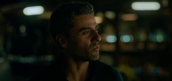 Movie still from “Triple Frontier” (2019), directed by J.C. Chandor – A person wearing a black shirt; Close Up shot, Over the shoulder angle