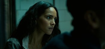 Movie still from “Triple Frontier” (2019), directed by J.C. Chandor – A person looking at a camera; Close Up shot, Over the shoulder angle