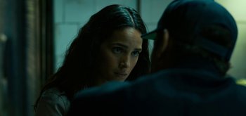 Movie still from “Triple Frontier” (2019), directed by J.C. Chandor – A woman looking into a mirror with a man next to her; Close Up shot, Over the shoulder angle
