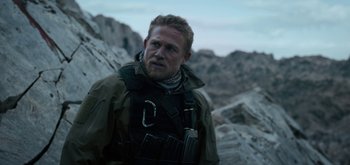 Movie still from “Triple Frontier” (2019), directed by J.C. Chandor – A person wearing a jacket; Close Up shot, Over the shoulder angle
