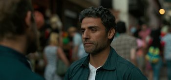 Movie still from “Triple Frontier” (2019), directed by J.C. Chandor – A person wearing a green shirt; Close Up shot, Over the shoulder angle