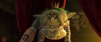 Movie still from “Trolls” (2016), directed by Mike Mitchell – A troll with green hair and a green crown; Medium shot, High angle