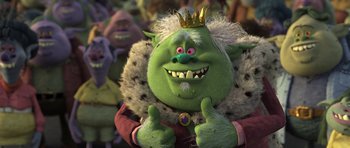 Movie still from “Trolls” (2016), directed by Mike Mitchell – A green troll with a crown and thumbs up; Medium shot, High angle