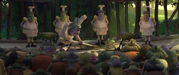 Movie still from “Trolls” (2016), directed by Mike Mitchell – A group of people standing in front of a stage; Wide shot, High angle