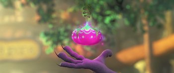 Movie still from “Trolls” (2016), directed by Mike Mitchell – A purple hand reaching up to catch a pink ornament hanging from the ceiling; Extreme Close Up shot, High angle