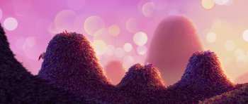 Movie still from “Trolls” (2016), directed by Mike Mitchell – A pink background with a bunch of bushes in the foreground; Extreme Wide shot, Low angle