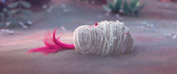 Movie still from “Trolls” (2016), directed by Mike Mitchell – A ball of white yarn with a bright pink tail; Extreme Close Up shot, High angle