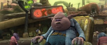 Movie still from “Trolls” (2016), directed by Mike Mitchell – An image of an animated character in front of a neon sign; Medium shot, Low angle