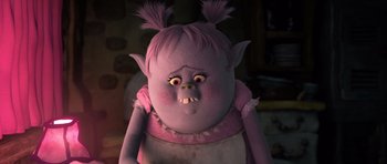 Movie still from “Trolls” (2016), directed by Mike Mitchell – A troll doll with pink hair and a pink shirt; Close Up shot, High angle