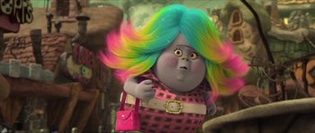 Movie still from “Trolls” (2016), directed by Mike Mitchell – A woman with colorful hair is holding a pink purse; Medium shot, High angle