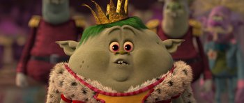 Movie still from “Trolls” (2016), directed by Mike Mitchell – A cartoon character with a crown on his head; Extreme Close Up shot, Low angle