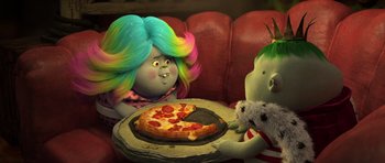 Movie still from “Trolls” (2016), directed by Mike Mitchell – Two people sitting on a red couch with a pizza on a plate; Medium shot, High angle