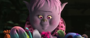 Movie still from “Trolls” (2016), directed by Mike Mitchell – A troll with a pink shirt is looking at the camera; Close Up shot, High angle