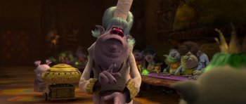 Movie still from “Trolls” (2016), directed by Mike Mitchell – An animated character with a hat on his head; Medium shot, Over the shoulder angle